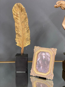 Gold Feather on Plinth