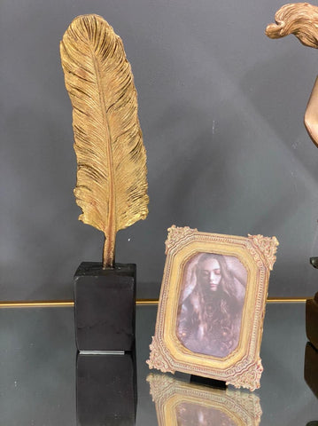 Gold Feather on Plinth